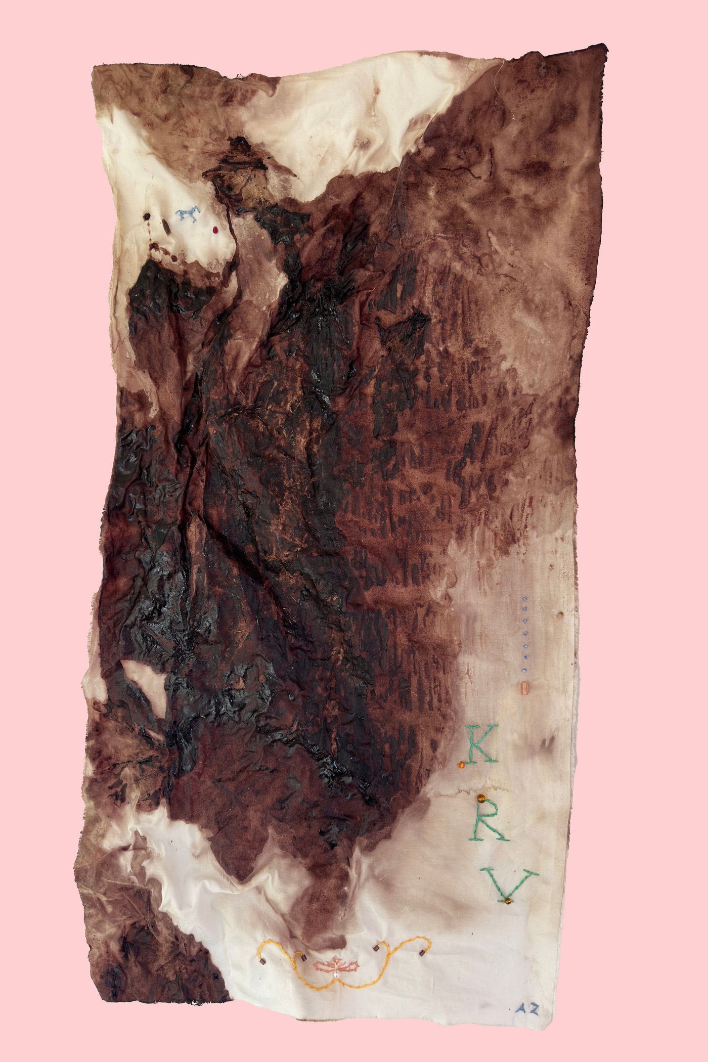 Embroidered textile covered in menstrual blood hardened over time made my Ashlee Zlatna.